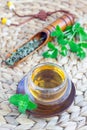 Healthy herbal mint tea in oriental cup with fresh peppermint and tea scoop on background, vertical Royalty Free Stock Photo