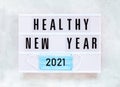Healthy Holidays New Year 2021 concept banner during coronavirus COVID-19 time. Top view of disposable protective face mask with