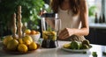 Healthy home scene Young woman pours fruit smoothie in the kitchen