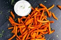 Healthy Homemade Baked Orange Sweet Potato Fries with fresh cream dip souce, herbs, salt and pepper.