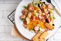 Healthy homemade breakfast. eggs with sausages , spices ,arugula served in a plate Royalty Free Stock Photo