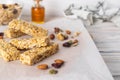 Healthy homemade granola bars with nuts, honey and dried fruit on wooden table Royalty Free Stock Photo