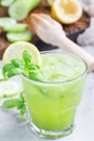 Healthy homemade lemonade with cucumber, basil, lemon, honey, sparkling water, vertical Royalty Free Stock Photo