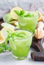 Healthy homemade lemonade with cucumber, basil, lemon, honey, sparkling water, vertical Royalty Free Stock Photo