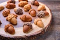 Healthy homemade Maple Acorn Cakelets, acorn shape cookies on wood slice serving board, server, tray. Closeup.