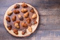 Healthy homemade Maple Acorn Cakelets, acorn shape cookies on wood slice serving board, server, tray.