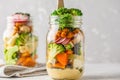 Healthy Homemade Mason Jar Salad with baked vegetables, hummus, Royalty Free Stock Photo