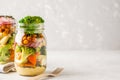 Healthy Homemade Mason Jar Salad with baked vegetables, hummus, Royalty Free Stock Photo