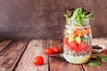 Healthy mason jar salad with vegetables and quinoa, table scene on dark background Royalty Free Stock Photo