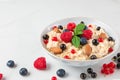 Healthy homemade oatmeal porridge with berries, nuts and mint. diet breakfast food concept Royalty Free Stock Photo