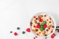 Healthy homemade oatmeal porridge with berries, nuts and mint. diet breakfast food concept. top view Royalty Free Stock Photo