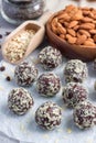 Healthy homemade paleo chocolate energy balls on parchment, vertical