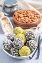 Healthy homemade paleo chocolate energy balls on plate, vertical
