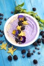 Healthy homemade raw vegan banana and berry ice cream icecream, nicecream topped with organic blackberries and blueberry