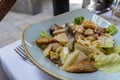 Healthy homemade salad with lettuce, anchovies, crispy chicken