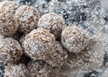 Healthy homemade sweet balls of dried fruits and nuts in coconut Royalty Free Stock Photo