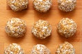 Healthy homemade sweet energy balls of dried fruits and nuts in coconut. The composition of dried apricots, raisins Royalty Free Stock Photo