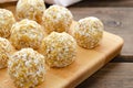 Healthy homemade sweet energy balls of dried fruits and nuts in coconut. The composition of dried apricots, raisins Royalty Free Stock Photo