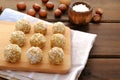 Healthy homemade sweet energy balls of dried fruits and nuts in coconut on a cutting board. As a part of hazelnut dried Royalty Free Stock Photo
