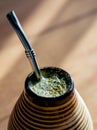 Yerba mate in ceramic matero, bombilla.