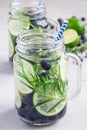 Healthy infused water with fresh blueberry, lime and rosemary, vertical Royalty Free Stock Photo