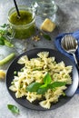 Healthy Italian cuisine. Pasta with green peas and pesto sauce in black bowl Royalty Free Stock Photo