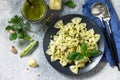 Healthy Italian cuisine. Pasta with green peas and pesto sauce in black bowl Royalty Free Stock Photo