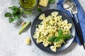 Healthy Italian cuisine. Pasta with green peas and pesto sauce in black bowl Royalty Free Stock Photo