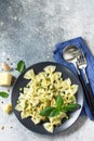 Healthy Italian cuisine. Pasta with green peas and pesto sauce in black bowl Royalty Free Stock Photo