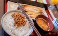 Healthy Japanese breakfast with Miso soup, grilled fish, rice and fermented soy beans called Natto Royalty Free Stock Photo