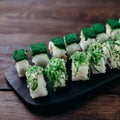 Sushi rolls with chuka and green tobiko caviar