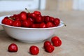 Healthy, juicy, fresh, organic cherries in fruit bowl close up. Cherries in background. Royalty Free Stock Photo