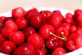 Healthy, juicy, fresh, organic cherries in fruit bowl close up. Cherries in background. Royalty Free Stock Photo