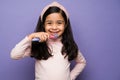 Healthy kid happy brushing her teeth Royalty Free Stock Photo