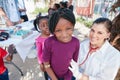 Healthy kids are happy kids. Portrait of volunteer nurses giving checkups to underprivileged kids.