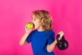 Healthy kids. Sport child workout. Child exercising with kettlebell. Sporty child with kettlebell dumbbell. Fit kids Royalty Free Stock Photo