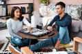 The healthy kind of game playing. a young couple playing a game of backgammon at home. Royalty Free Stock Photo