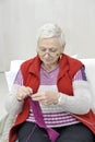 Healthy knitting senior woman