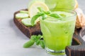 Healthy lemonade with cucumber, basil, lemon, honey and sparkling water, horizontal, copy space