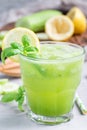 Healthy lemonade with cucumber, basil, lemon, honey and sparkling water, vertical Royalty Free Stock Photo
