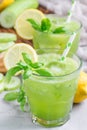Healthy lemonade with cucumber, basil, lemon, honey and sparkling water, vertical Royalty Free Stock Photo