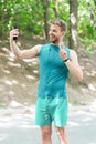 healthy life. athletic man in sportswear make selfie. outdoor workout. Fitness app. Ui ux concept. gadget in modern Royalty Free Stock Photo