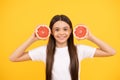 healthy life. diet and kid skin beauty. smiling teen girl with grapefruit. vitamin and dieting.