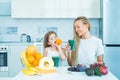 Healthy life and food concept. Superfood. Happy child have a breakfast. Fitness and dieting. Mother and daughter Royalty Free Stock Photo