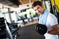 Healthy life and gym exercise concept. Fit man working out in sport fitness club Royalty Free Stock Photo