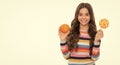 healthy life. kid choose food. happy teen girl with orange lollipop. vitamin and dieting. Royalty Free Stock Photo