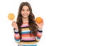 healthy life. kid choose food. happy teen girl with orange lollipop. vitamin and dieting. Royalty Free Stock Photo