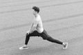 healthy life and self-control concept. Young citizen exercising outside and standing in yoga. Young athlete stretch in Royalty Free Stock Photo