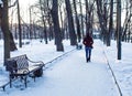 Healthy lifestyle in the city, winter weekend, woman walking in the Park