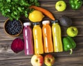 Healthy lifestyle concept with juice bottles, vegetables and fruits on wooden board, top view, healthy living fitness Royalty Free Stock Photo